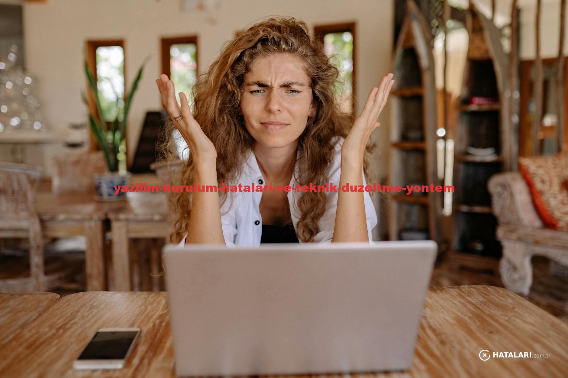 A woman frustrated with her laptop while working remotely indoors, expressing stress.